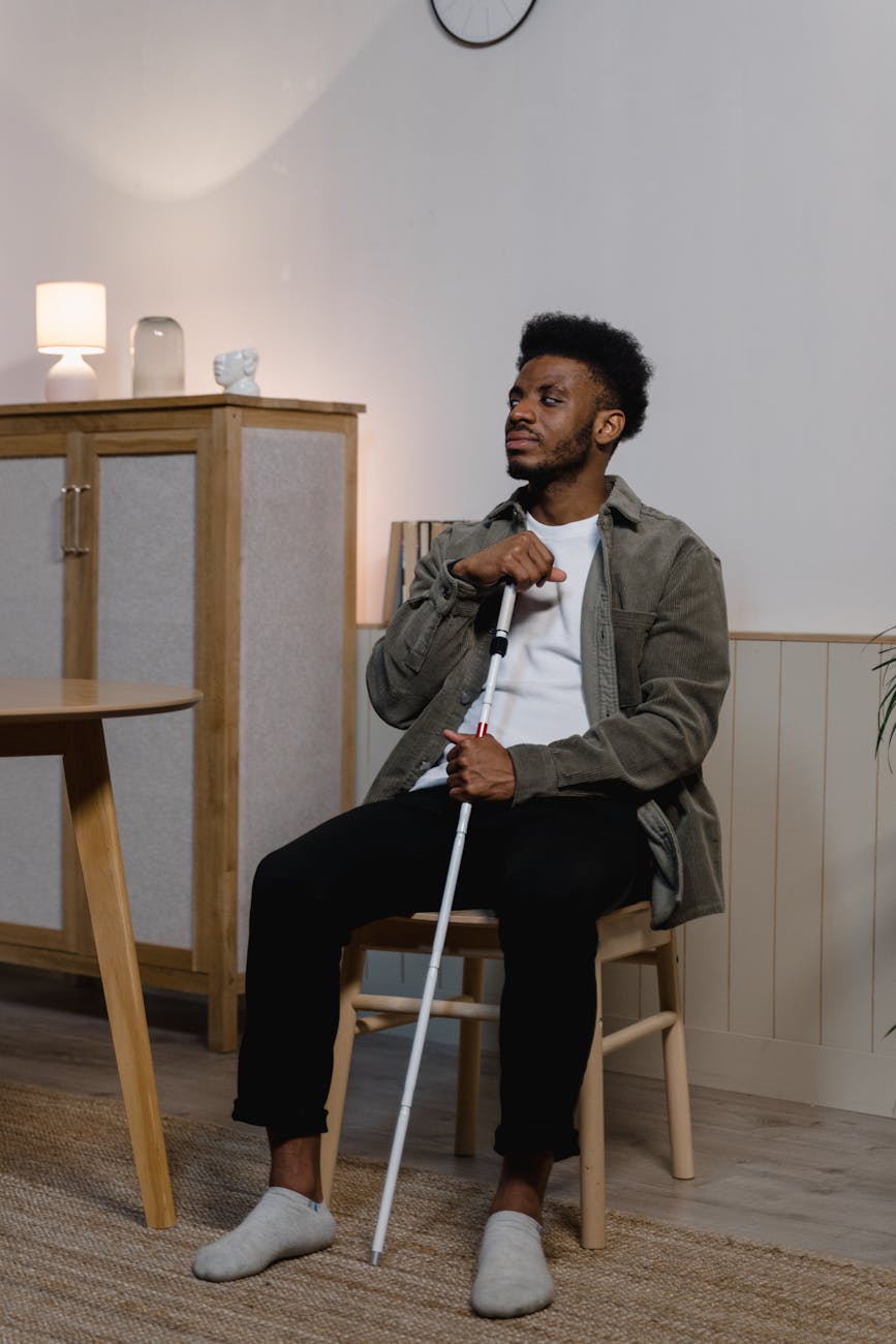 blind man sitting on a chair